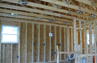 interior of a building with wooden planks being wired